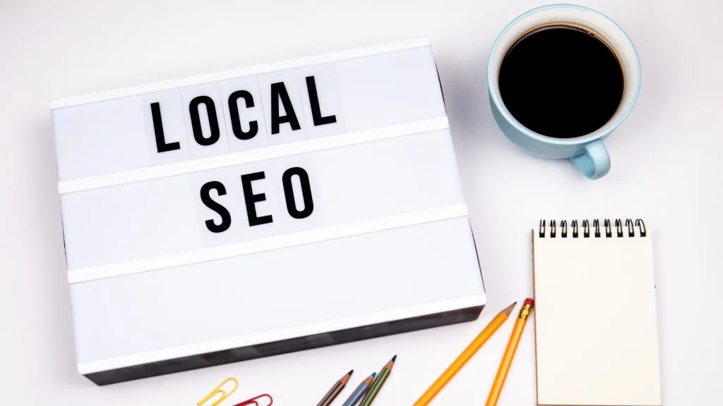 Lightbox displaying 'LOCAL SEO' with office supplies, reflecting Local SEO Agency Growmatic’s focus on local SEO solutions.